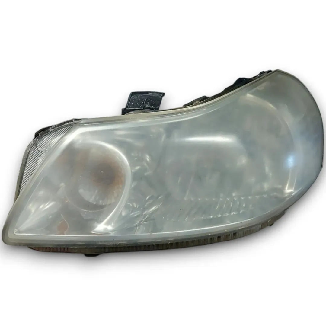 Faro anteriore sinistro Fiat Sedici 2006–2011 OEM 71742454